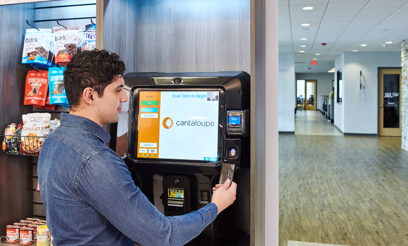 An entrepreneur using a Cantaloupe-branded vending kiosk