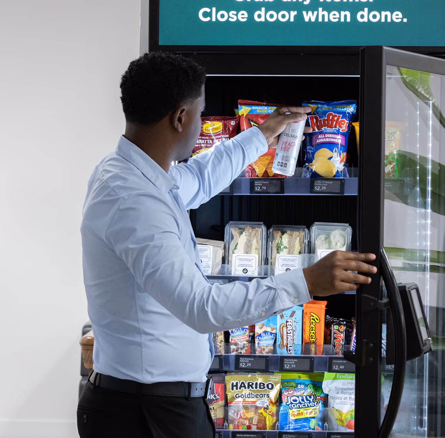 An entrepreneur stocking a smart vending machine